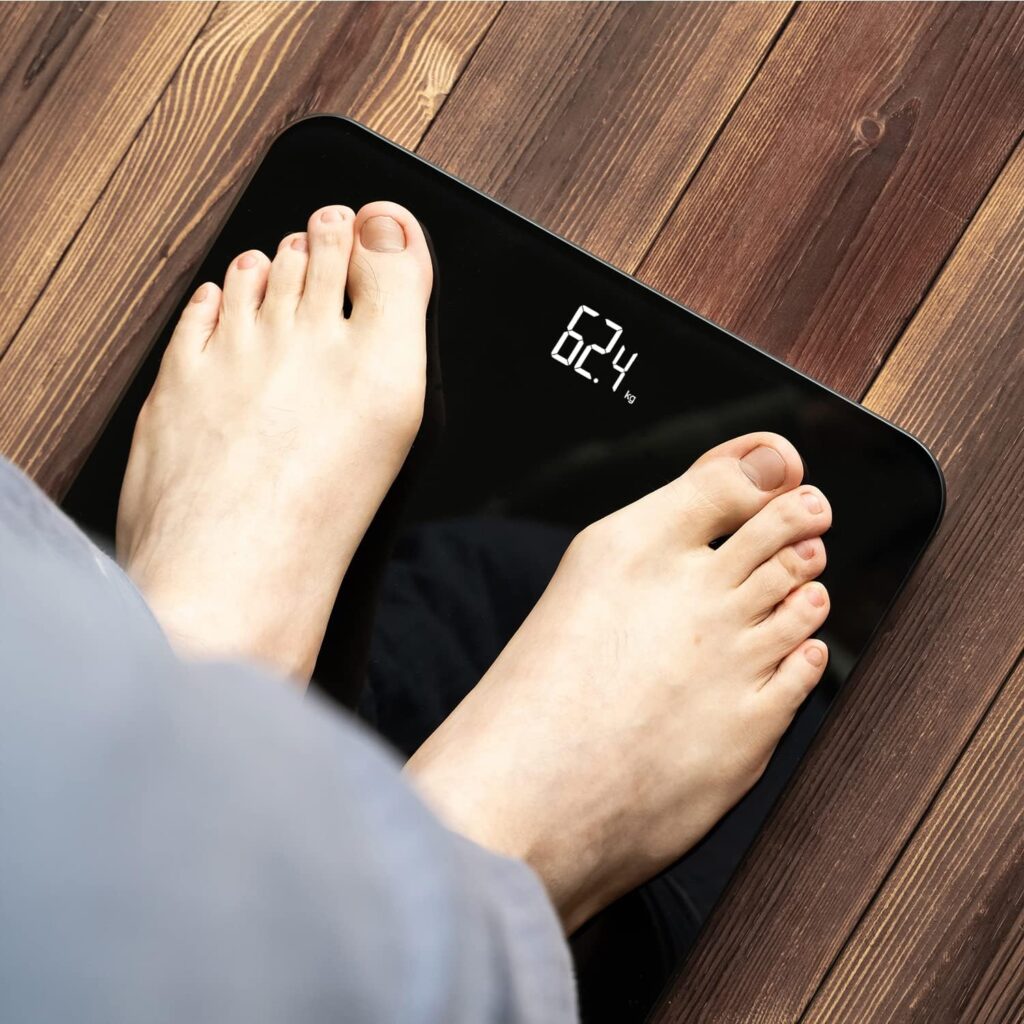 BAGAIL Bathroom Scale, Digital Weighing Scale with High Precision Sensors and Tempered Glass, Ultra Slim, Step-on Technology, Shine-Through Display - 15Yr Guarantee - Black